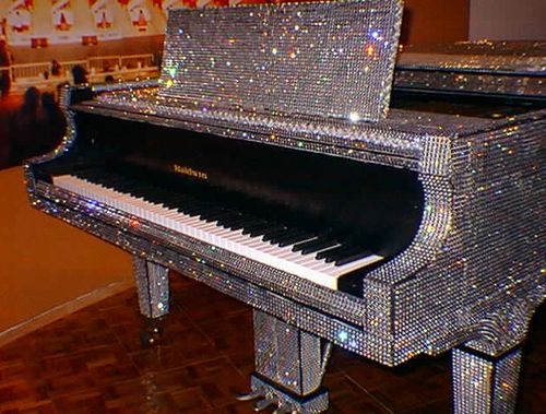 Everyone has a friend that is obsessed with sparkly, glittery things or everything Liberache. Here is the perfect piano for that friend that just can't help bedazzling everything they own.